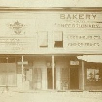 View of front of building with the Phoenix Gallery, Globe Portrait Company, and a Bakery and Confectionary