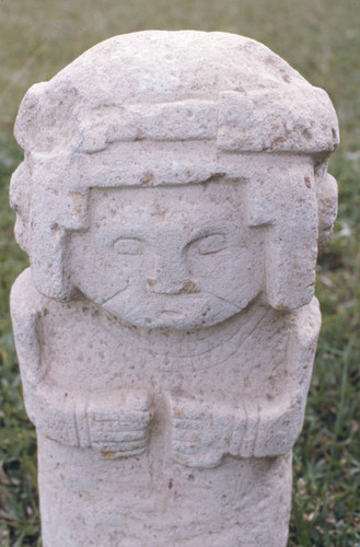 Columnar stone statue of a woman, San Agustín, Colombia, 1975