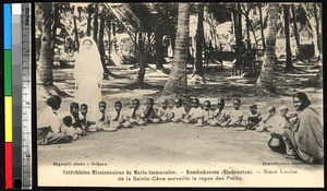 Children eating with a nun and two women, Kumbakonam, India, ca.1920-1940