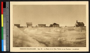 Several wooden buildings and a church standing on a plain of ice, Canada, ca.1920-1940