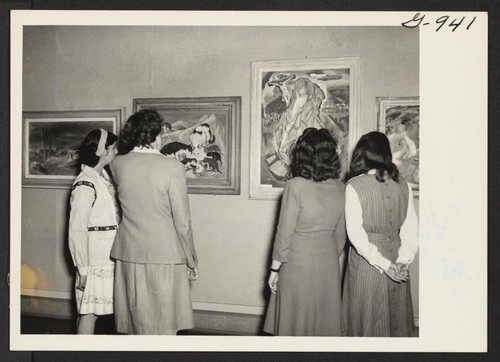 Students at the New Jersey College for Women, New Brunswick, New Jersey, view an exhibit of paintings and sculptures by