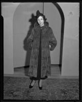 Woman models fur coat at the Times' fashion show, Los Angeles, 1935
