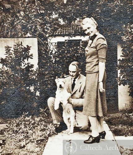 Richard and Ruth Tolman and their dog in front of their home