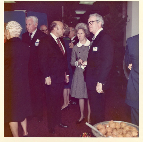Chancellor Young speaking to Parker Sullivan, Mrs. Sullivan between them, Grant Morgan behind them