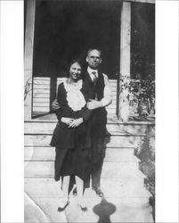 Unidentified son of Julia and Washington Neil standing with unidentified woman in front of house at 231 Wilson Street, Petaluma, California, about 1925