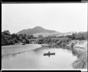 View of the Rush (Russian?) River at Fitch Mountain, showing a man in a row boat