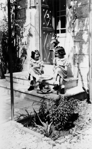 Sisters in front of Jerusalem home