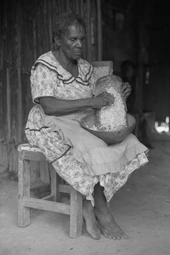 Woman grating coconut, San Basilio de Palenque, 1976