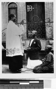 Priest giving first blessing, Uganda, Africa, 1939