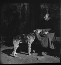 Village. Woman with dog