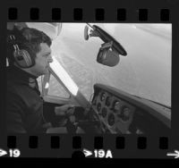 Radio station KGIL's traffic reporter, Francis Gary Powers at controls of plane in Los Angeles, Calif., 1973