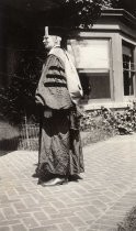 Side view of de Forest in robe and hood, honorary degree, Yale