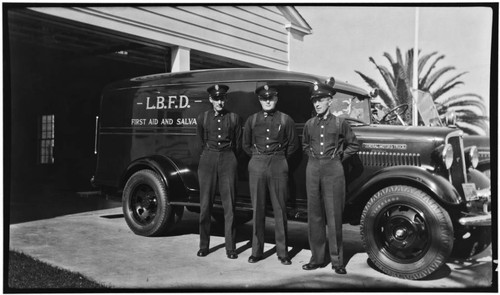 Cherry rescue (first aid and salvage) crew with apparatus outside Station No. 7, 2295 Elm Avenue