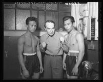 Trainer Louis Ficorilli coaching two Filipino boxers in Los Angeles, Calif., 1949