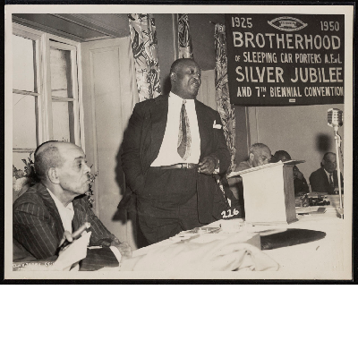 Man speaking to the Silver Jubilee and 7th Biennial Convention of the Brotherhood of Sleeping Car Porters