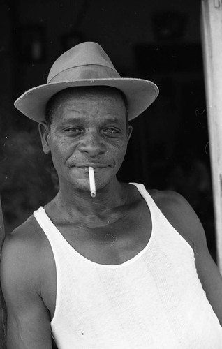Man with hat smoking a cigarette, San Basilio de Palenque, 1976