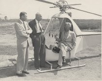 Ralph M. Heintz, Sr., and two unidentified men with early Hiller helicopter, ca. 1948