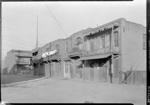 View of buildings along Juan Street in Los Angeles's Chinatown, including a "haunted house", November 1933