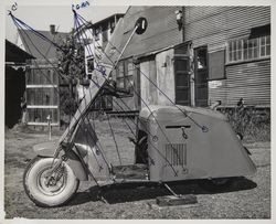 Motorized scooter in the back yard, Petaluma, California, April 18, 1953