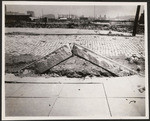 [Buckled curb stone. South of Market St.?]