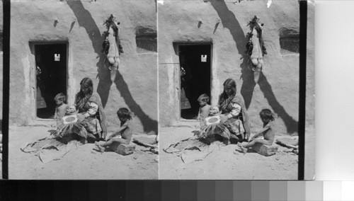 Hopi Indian Woman's occupation - baby nursing and basket weaving - Oraibi - Arizona