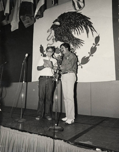 Rudy Acuña presents a plaque to Sal Castro (right)