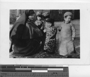 Sister Ellen Mary with orphans at Fushun, China