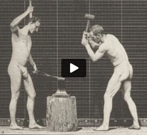 Men in pelvis clothes hammering an anvil