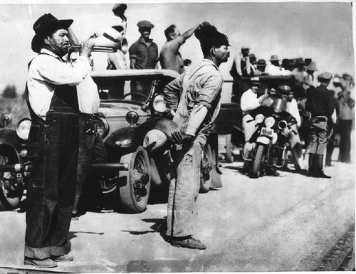 Pickets on the highway calling workers from the fields, 1933 cotton strike