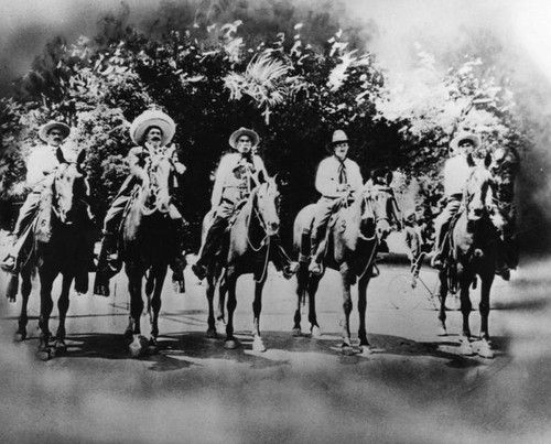 Mexican American men on horseback