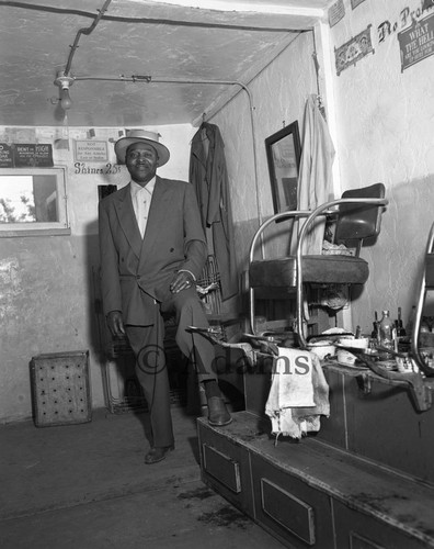 Man in shoe shine shop, Los Angeles, 1956