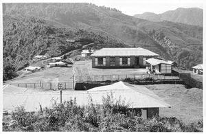 NELC, Assam, Nordindien og Bhutan. Parkijuli Kristne Hospital ligger tæt på grænsen til Bhutan. Hospitalet blev grundlagt af et norsk missionærpar, læge Edel Busch Haugstad og pastor Magnus Haugstad, og udvidet til 75 senge i 1960erne. Mange patienter kom fra Bhutan, hvorfor de ansøgte om og fik kongen af Bhutans tilladelse til at starte sundhedsarbejde inde i landet og bygge et hospital her. Stedet blev Riserboo, hvor grundstenen blev nedlagt i 1967. Hospitalet ses på dette foto med følgende beskrivelse: Dette er Riserboo – Sygehuset i forgrunden. På den anden side af vejen boliger for medarbejdere, og øverst oppe ligger lægeboligen