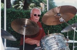 Richard Rolfs, S.J., playing drums
