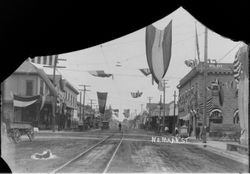 North Main Street in Sebastopol with P&SR train tracks and American flags and other flags for an unidentified celebration