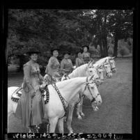 Five women riding Camarillo white horses during Old Spanish Days Fiesta in Santa Barbara, Calif., 1965