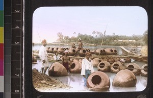 Men with water jars on the Irrawaddy, Myanmar, s.d