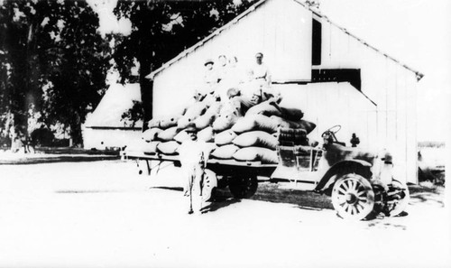 Peirano Place with truck load of grain