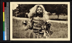 Sorcerer in costume made of grasses, Congo, ca.1920-1940