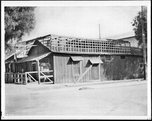 Exterior view of the first store built in Hollywood, at the corner of Sunset Boulevard and Cahuenga Avenue, ca.1910