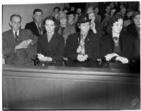 Samuel Karnes, Sr., Johanna Karnes, Edith Karnes, and Audrey Burns sit in the courtroom during the preliminary trial for Betty Flay Hardaker, Los Angeles, 1940