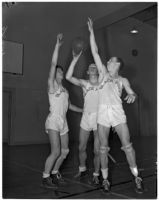 Black-Foxe Military Institute students in uniform on the basketball court for their traditional competition against Cumnock School, Los Angeles, 1937