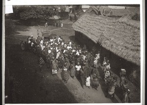 Drunken natives returning from a funeral ceremony