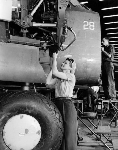 Woman working on an aircraft