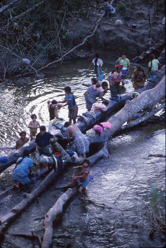 Guatemalan refugee women and children wash themselves and their clothes in the rive, Puerto Rico, 1983