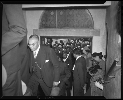Crowd walking in church entrance at G.C. Coleman funeral service