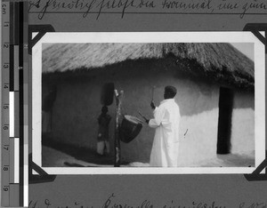 The evangelist Mika beating the drum, Sikonge, Unyamwezi, Tanzania, 1933
