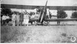 Admirer's stand beside August Sam Huck's JN4 biplane, called a "Jenny,", about 1930 in Sebastopol