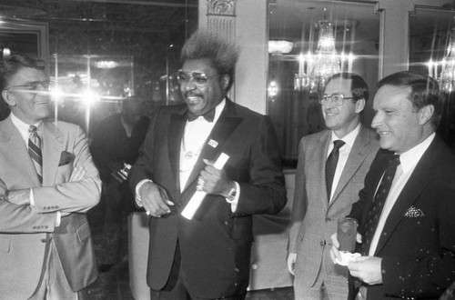 Don King posing at press conference for the "Crown Affair" boxing event, Los Angeles, 1983