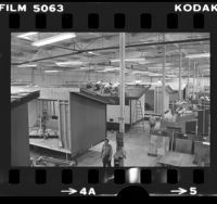 Workers building prefabricated houses in factory in Fountain Valley, Calif., 1976