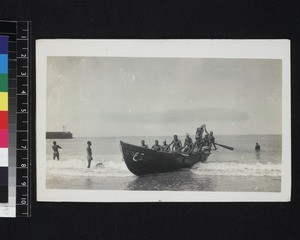Men in large rowing boat, Ghana, 1926